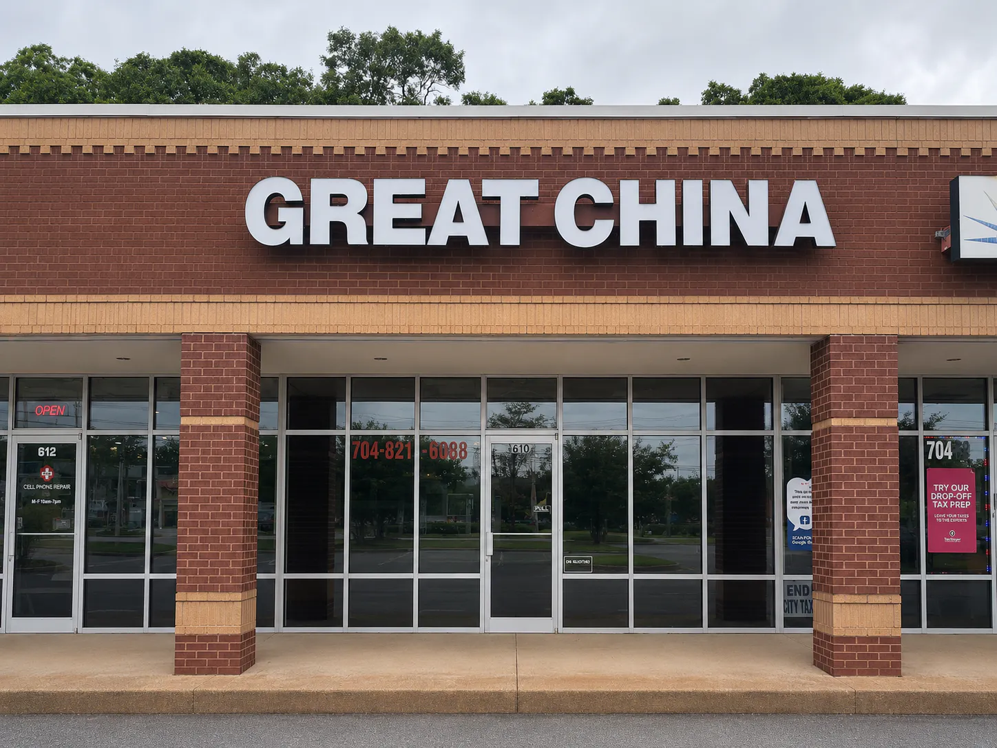 Great China restaurant storefront with a large white sign on a brick wall and glass windows